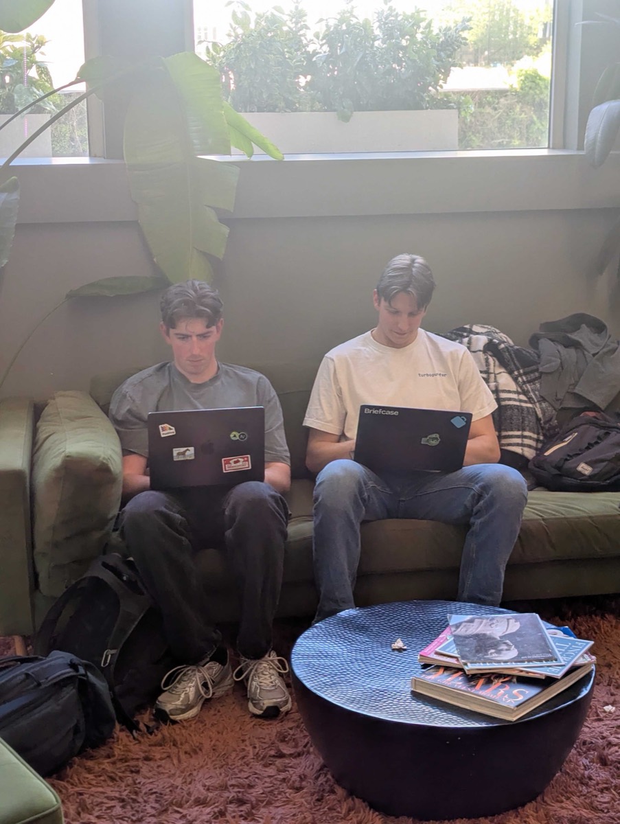 Alex and Che hacking at our hackathon