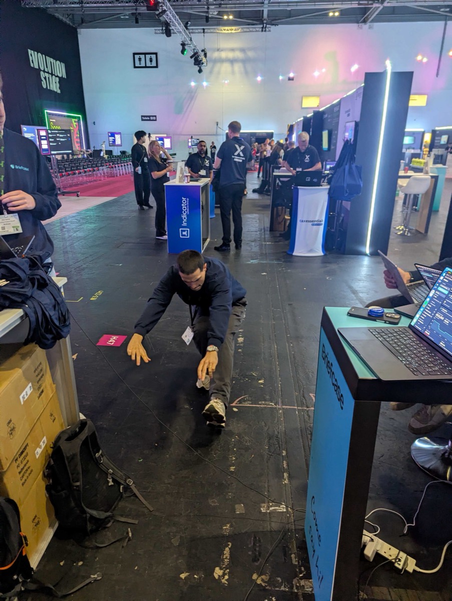 Reuben pistol squatting on our conference stand
